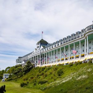 On July 10, 1887, the Grand Hotel opened on Mackinac Island—built in just 93 days atop centuries of mystery, beauty, and buried history.