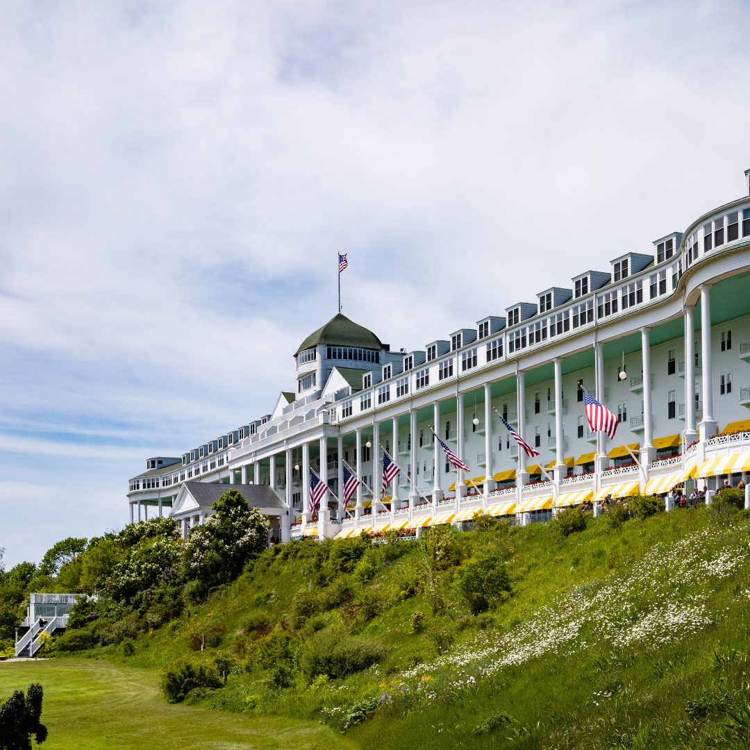 On July 10, 1887, the Grand Hotel opened on Mackinac Island—built in just 93 days atop centuries of mystery, beauty, and buried history.