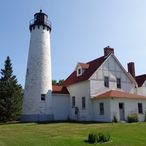 Discover the history of Point Iroquois Light, a Great Lakes lighthouse guarding the St. Marys River since 1856 near Brimley, Michigan.