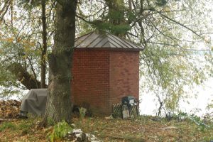 Historic Brick oil house still remains. Six Mile Point Range Lights guide ships through the Neebish Channel, reflecting major navigation improvements along the St. Marys River.