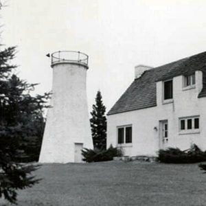 Old Presque Isle Lighthouse, built in 1840 on Lake Huron, now serves as a museum reflecting early navigation history and local legend.