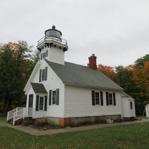 Mission Point Lighthouse on Old Mission Peninsula guided ships for decades and stands near the forty-fifth parallel overlooking Grand Traverse Bay.